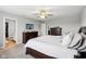 Spacious main bedroom with a ceiling fan, a wall-mounted TV and an ensuite bathroom with a walk-in closet at 8663 Kellner St, Pendleton, IN 46064