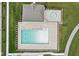 Aerial view of the community pool and splash pad surrounded by well-maintained greenery at 8663 Kellner St, Pendleton, IN 46064