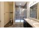 Bathroom features a tiled walk-in shower with glass doors and a granite countertop with double sinks at 944 Redwood Dr, Franklin, IN 46131