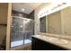 Bathroom features double sinks, granite countertops, and tiled stand up shower at 944 Redwood Dr, Franklin, IN 46131