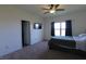 Bedroom with queen bed, ceiling fan, and mounted television provides a peaceful retreat at 944 Redwood Dr, Franklin, IN 46131