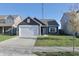 Charming one-story home with a well-maintained lawn and a two-car garage at 944 Redwood Dr, Franklin, IN 46131