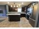 Spacious kitchen featuring dark cabinetry, stainless steel appliances, and central island at 944 Redwood Dr, Franklin, IN 46131