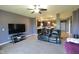 Open living area with television, fireplace and electric sofa with view of kitchen at 944 Redwood Dr, Franklin, IN 46131