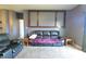 Living room with a comfy reclining loveseat under a decorative window feature at 944 Redwood Dr, Franklin, IN 46131