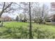 Expansive backyard with a playground, trampoline, and manicured lawn, ideal for Gathering fun and outdoor enjoyment at 9760 Logan Ln, Fishers, IN 46037