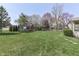 Lush backyard with a playground, trampoline, and plenty of space for outdoor activities and recreation at 9760 Logan Ln, Fishers, IN 46037