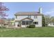 Spacious backyard featuring a deck with seating and lush lawn, creating a perfect outdoor space for entertaining at 9760 Logan Ln, Fishers, IN 46037