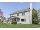 Well-maintained backyard featuring a screened porch, deck, and lush green lawn, ideal for outdoor relaxation at 9760 Logan Ln, Fishers, IN 46037