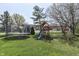 Backyard featuring a trampoline and playset, perfect for Gathering fun and outdoor activities at 9760 Logan Ln, Fishers, IN 46037