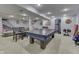 Finished basement with ping pong table and exercise equipment, offers versatile space for recreation and fitness at 9760 Logan Ln, Fishers, IN 46037