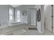 Bathroom featuring a tub, shower, and lots of light at 9760 Logan Ln, Fishers, IN 46037