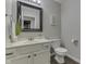 Cozy bathroom featuring a vanity with a framed mirror and warm accents at 9760 Logan Ln, Fishers, IN 46037