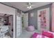 Bedroom featuring a lofted bed with a desk area below and pink accents at 9760 Logan Ln, Fishers, IN 46037