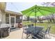 Outdoor deck with an umbrella, dining table, and chairs, perfect for al fresco dining and entertaining at 9760 Logan Ln, Fishers, IN 46037