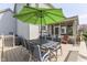 Outdoor deck with an umbrella, dining table, and chairs, perfect for al fresco dining and entertaining at 9760 Logan Ln, Fishers, IN 46037