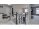 Upstairs landing showing the hardwood stairs and adjacent bedrooms at 9760 Logan Ln, Fishers, IN 46037