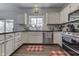 Charming kitchen with granite counters, stainless appliances, and a bright window at 9760 Logan Ln, Fishers, IN 46037