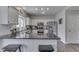 Kitchen featuring granite counters, stainless appliances, and a central island with seating at 9760 Logan Ln, Fishers, IN 46037