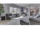 A sun-drenched living room with hardwood floors and ample seating at 9760 Logan Ln, Fishers, IN 46037