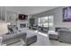 Comfortable living room featuring a brick fireplace and large window at 9760 Logan Ln, Fishers, IN 46037