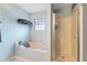 Bright bathroom featuring a large tub, shower, and serene decor for a spa-like atmosphere at 1014 Sugar Maple Dr, Greenwood, IN 46143