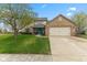 Charming two-story home with brick accents, a well-manicured lawn, and a bright blue front door at 1014 Sugar Maple Dr, Greenwood, IN 46143