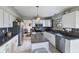 Bright kitchen featuring white cabinets, stainless steel appliances, an island, and tile backsplash at 1014 Sugar Maple Dr, Greenwood, IN 46143