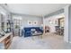 Comfortable living room with blue sofa and a view of the dining area, creating an open, airy atmosphere at 1014 Sugar Maple Dr, Greenwood, IN 46143