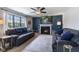 Comfortable living room with plush sofas, a fireplace, and large windows that fill the space with natural light at 1014 Sugar Maple Dr, Greenwood, IN 46143