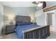 Spacious bedroom with rustic wood furniture, soft lighting, and neutral tones for a calming retreat at 1014 Sugar Maple Dr, Greenwood, IN 46143