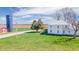 Expansive property featuring a classic farmhouse, outbuildings, and lush green fields at 10723 E State Road 234, Wilkinson, IN 46186