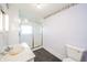 The bathroom has a shower, toilet, and vanity with a marble countertop at 10723 E State Road 234, Wilkinson, IN 46186