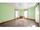 This bedroom has hardwood floors and two windows at 10723 E State Road 234, Wilkinson, IN 46186
