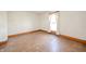 This bedroom features original hardwood floors and a large window at 10723 E State Road 234, Wilkinson, IN 46186