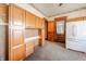 Spacious kitchen featuring wood cabinets, a built-in desk, and ample storage space at 10723 E State Road 234, Wilkinson, IN 46186