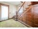Elegant staircase featuring detailed wood trim and a decorative paneled wall at 10723 E State Road 234, Wilkinson, IN 46186