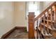 Classic staircase with ornate wood detailing and natural light from the adjacent window at 10723 E State Road 234, Wilkinson, IN 46186