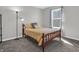 Cozy bedroom features natural light from window and comfy bed with decorative pillows at 10844 Tedder Lake Dr, Indianapolis, IN 46239