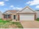 Charming single-story home with brick accents, a two-car garage, and well-maintained lawn under a bright sky at 10844 Tedder Lake Dr, Indianapolis, IN 46239
