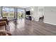 Spacious living room with hardwood floors, large windows overlooking the backyard, and neutral paint at 10844 Tedder Lake Dr, Indianapolis, IN 46239