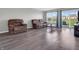 Bright living room featuring hardwood floors, natural light and neutral walls overlooking a fenced backyard at 10844 Tedder Lake Dr, Indianapolis, IN 46239
