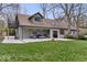 Backyard featuring a well-maintained lawn, patio furniture and an upper deck off the main bedroom at 1234 E 71St St, Indianapolis, IN 46220