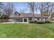 Lush backyard featuring a well-maintained lawn, patio and exterior home view, inviting outdoor relaxation and entertainment at 1234 E 71St St, Indianapolis, IN 46220