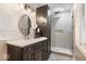Modern bathroom features vanity with sink, mirror, and glass-enclosed shower at 1234 E 71St St, Indianapolis, IN 46220