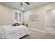 Bedroom with ceiling fan and natural light plus ensuite bathroom at 1234 E 71St St, Indianapolis, IN 46220