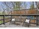 Outdoor deck with seating area, privacy screen, and nature views at 1234 E 71St St, Indianapolis, IN 46220