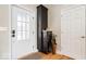 Inviting entryway featuring a glass-paneled door and a storage cabinet with space for umbrellas and other items at 1234 E 71St St, Indianapolis, IN 46220