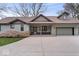 Spacious home with an attached garage and a concrete driveway at 1234 E 71St St, Indianapolis, IN 46220