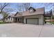 Spacious home with an attached garage and a concrete driveway at 1234 E 71St St, Indianapolis, IN 46220